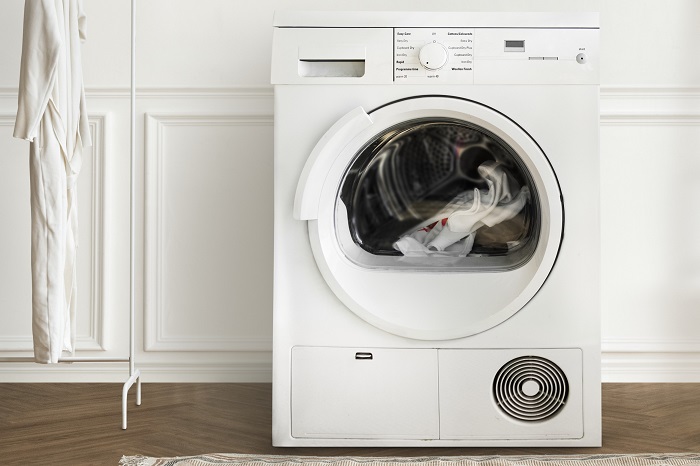 Washing machine in a minimal laundry room interior design